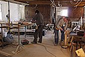 Graham and Christoph repairing window in the East Church, Cromarty